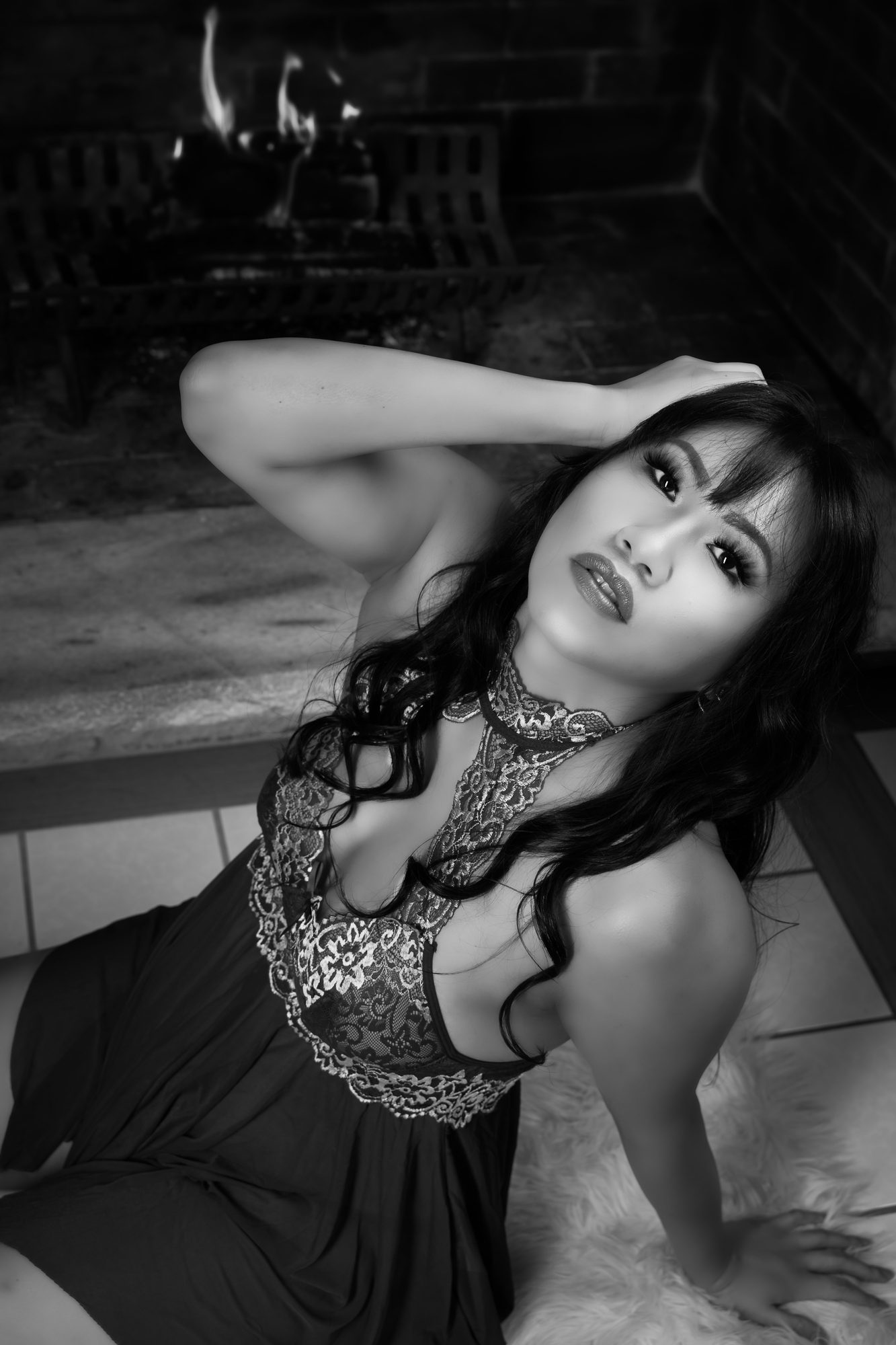 Client reclining by the fire in a lace chemise